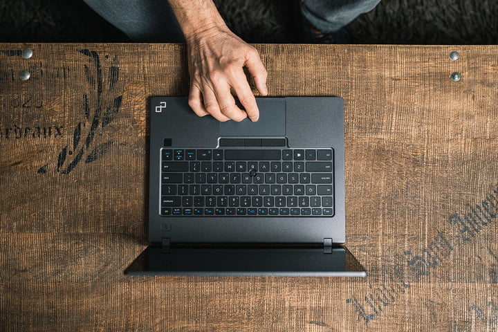 A person using the PrimeBook Circular modular laptop on a desk.