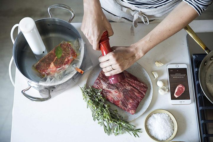The Breville Joule being used to measure a roasted chicken's temperature.