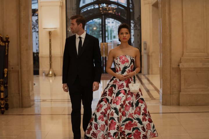 Sophie and James stand next to each other in evening wear in a scene from Surface.