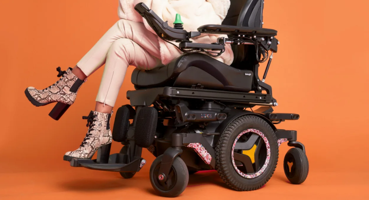 Luci autonomous wheelchair on orange backdrop